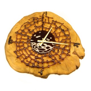 Wall clock made of art glass on a wooden base 